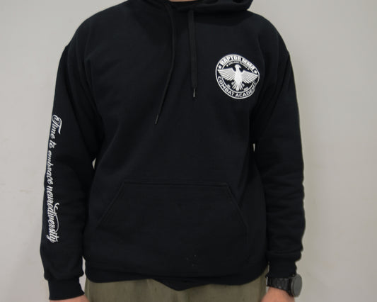 Black hoodie with a logo on the chest and text on the sleeve against a plain background
